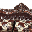 Leatherette Loveseat with Ornate Carvings