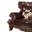 Leatherette Loveseat with Ornate Carvings